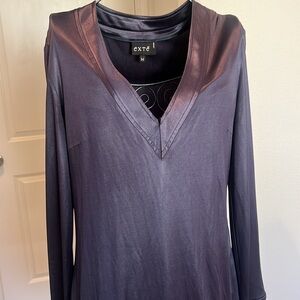Long sleeve cocktail dress in gunmetal color with side zipper. Size M